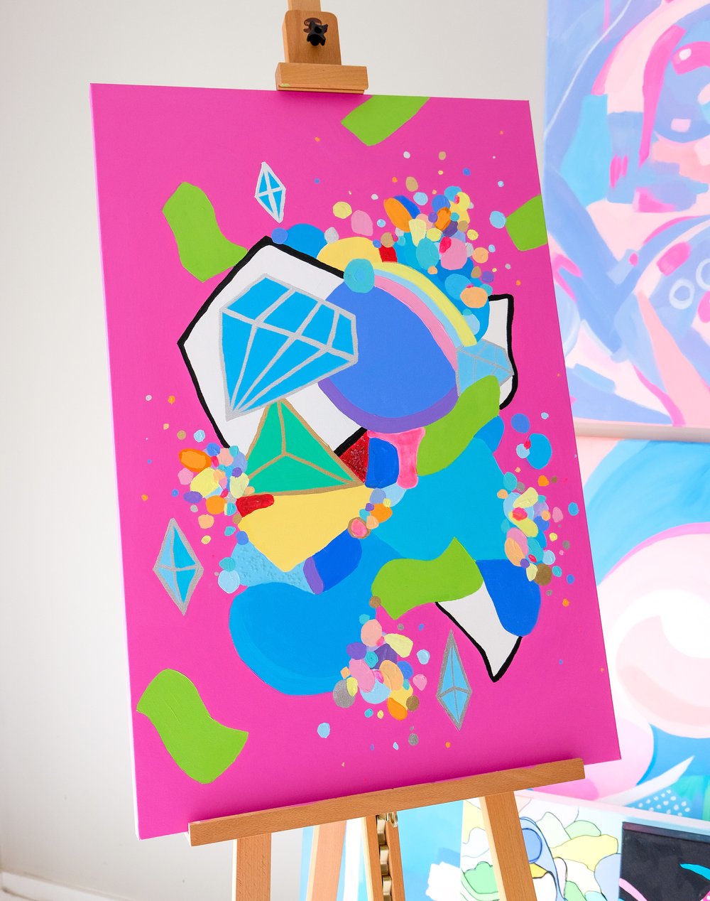 Abstract acrylic painting "Opulence" by Carina Dawn, filled with vivid color and rich money symbols.